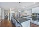 Modern kitchen featuring a large island with seating, stainless steel appliances, and seamless flow into the foyer at 1543 Watoga Way, Mount Pleasant, SC 29466