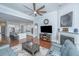 A modern living room featuring wood floors, a fireplace, and an open concept design at 1543 Watoga Way, Mount Pleasant, SC 29466