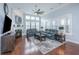 Bright living room with a fireplace, high ceilings, a ceiling fan, and ample windows at 1543 Watoga Way, Mount Pleasant, SC 29466