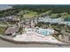 A picturesque aerial view captures a vibrant beachside resort with pools and beach access at 157 High Hammock Villas, Seabrook Island, SC 29455