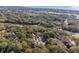 An aerial shot captures the property amid thick trees, featuring a parking space at 157 High Hammock Villas, Seabrook Island, SC 29455