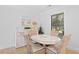 Coastal-themed dining area featuring wicker chairs, stylish decor and natural light at 157 High Hammock Villas, Seabrook Island, SC 29455