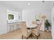 Bright dining room with coastal decor, glass table and wicker chairs at 157 High Hammock Villas, Seabrook Island, SC 29455