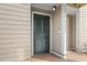 Condo entrance with a green louvered door and beige siding at 157 High Hammock Villas, Seabrook Island, SC 29455