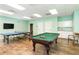 A spacious game room includes a pool table, ping pong table, and a kitchenette area at 157 High Hammock Villas, Seabrook Island, SC 29455