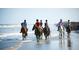 Horseback riding on the beach showing a group of people enjoying the scenic coastline at 157 High Hammock Villas, Seabrook Island, SC 29455