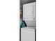 Laundry area with stacked washer and dryer units and nearby storage at 157 High Hammock Villas, Seabrook Island, SC 29455
