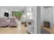 Open living room with light wood floors and sliding doors at 157 High Hammock Villas, Seabrook Island, SC 29455
