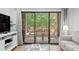 Cozy living room with glass doors to outdoor patio area and stylish furnishings at 157 High Hammock Villas, Seabrook Island, SC 29455