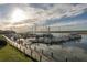 Picturesque marina view with boats docked and a wooden walkway, capturing the serene coastal lifestyle at 157 High Hammock Villas, Seabrook Island, SC 29455