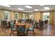 A well-lit meeting room with tables and chairs provides a great space for community gatherings at 157 High Hammock Villas, Seabrook Island, SC 29455