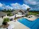 Inviting aerial view of the pool, water features, shade, seating, and clubhouse at 157 High Hammock Villas, Seabrook Island, SC 29455