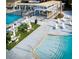 Inviting community pool area with sun loungers, umbrellas, and a covered bar area for residents at 157 High Hammock Villas, Seabrook Island, SC 29455