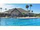 Resort-style pool with a water slide, palm trees, and plenty of lounge seating at 157 High Hammock Villas, Seabrook Island, SC 29455