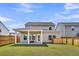 Spacious backyard with a covered patio area perfect for outdoor living and entertaining at 157 Tuscan Sun St, Summerville, SC 29485