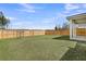 An expansive backyard bordered by a wooden fence and complemented by a covered patio at 157 Tuscan Sun St, Summerville, SC 29485