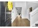 Welcoming entryway showcasing hardwood floors and a staircase leading to the upper level at 157 Tuscan Sun St, Summerville, SC 29485
