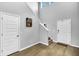 Bright entryway featuring hardwood floors, high ceilings, and a staircase to the second floor at 157 Tuscan Sun St, Summerville, SC 29485