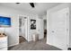 Bright hallway with multiple doorways, including one leading to the bathroom with a combined shower and tub at 157 Tuscan Sun St, Summerville, SC 29485