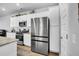 Spacious kitchen with stainless steel appliances and white cabinetry at 157 Tuscan Sun St, Summerville, SC 29485