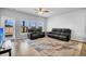 Spacious living room with recliner seating and view to the backyard at 157 Tuscan Sun St, Summerville, SC 29485