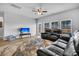 Bright living room featuring a TV, recliner seating, and natural light at 157 Tuscan Sun St, Summerville, SC 29485