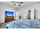 This bedroom features a comfortable bed set with a wooden dresser and TV, perfect for relaxing at 157 Tuscan Sun St, Summerville, SC 29485