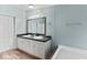 Bathroom featuring a double vanity with cabinet storage, large mirror, and tiled floors at 158 Dean Dr, Summerville, SC 29483