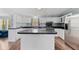 Well-lit kitchen featuring an island, stainless steel refrigerator and ample cabinet space at 158 Dean Dr, Summerville, SC 29483