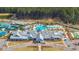 Overhead view of the community clubhouse, showcasing the pool, tennis courts, and beautifully landscaped grounds at 159 Garden Gate Way, Summerville, SC 29486