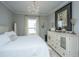Cozy bedroom featuring white walls, a chandelier, and white furniture at 159 Garden Gate Way, Summerville, SC 29486