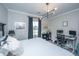 Comfortable bedroom with decorative lighting, curtains, and a plush bed with patterned pillows at 159 Garden Gate Way, Summerville, SC 29486