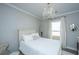 Cozy bedroom featuring white walls, a chandelier, and white furniture at 159 Garden Gate Way, Summerville, SC 29486