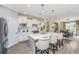 Bright open kitchen with a large center island, stainless appliances, and seamless flow to dining and living spaces at 159 Garden Gate Way, Summerville, SC 29486