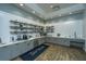 Amenity center kitchenette with stylish gray cabinetry, subway tile backsplash, and coffee bar at 159 Garden Gate Way, Summerville, SC 29486