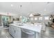 Spacious kitchen with a large island and seamless flow into a living room and dining area, perfect for gatherings at 159 Garden Gate Way, Summerville, SC 29486