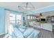 Cozy living room with a comfortable patterned sofa and natural light from the large windows at 159 Garden Gate Way, Summerville, SC 29486