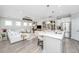 Open concept kitchen and living area with a large island and modern finishes, creating an inviting space at 159 Garden Gate Way, Summerville, SC 29486
