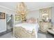 Beautiful bedroom with decorative furnishings, a chandelier, and an attached bathroom at 159 Garden Gate Way, Summerville, SC 29486