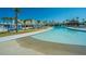 Large pool with varying depths, featuring lounge areas and palm trees, great for relaxation at 159 Garden Gate Way, Summerville, SC 29486