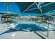 Relaxing pool with lounge chairs partially submerged in water, overlooking the clubhouse at 159 Garden Gate Way, Summerville, SC 29486