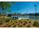 Well-maintained tennis courts surrounded by lush greenery and shaded seating areas at 159 Garden Gate Way, Summerville, SC 29486