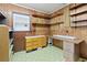 Finished basement area with wood paneled walls, built-in shelves and storage at 1636 Pinopolis Rd, Moncks Corner, SC 29461