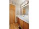 Bathroom featuring a sink with wood cabinets and floral wallpaper at 1636 Pinopolis Rd, Moncks Corner, SC 29461