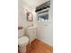 Bathroom features a white sink vanity, wood-look floors and decorative mirror at 1636 Pinopolis Rd, Moncks Corner, SC 29461