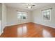 Bright bedroom featuring hardwood floors, a ceiling fan, and sunlit windows at 1636 Pinopolis Rd, Moncks Corner, SC 29461