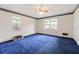 Bedroom featuring blue carpet, natural light, and classic trim at 1636 Pinopolis Rd, Moncks Corner, SC 29461