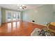 Sunny bedroom featuring hardwood floors, neutral walls, and French doors to the backyard at 1636 Pinopolis Rd, Moncks Corner, SC 29461