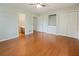 Spacious bedroom with hardwood floors, ceiling fan, and built-in storage at 1636 Pinopolis Rd, Moncks Corner, SC 29461