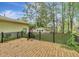 View from the wood deck of the backyard with mature trees and landscaping at 1636 Pinopolis Rd, Moncks Corner, SC 29461